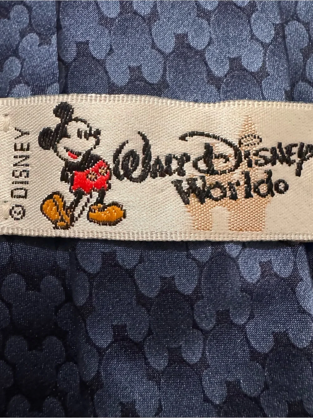 Walt Disney World Mickey Mouse Tie. Navy with subtle Mickey Mouse design.